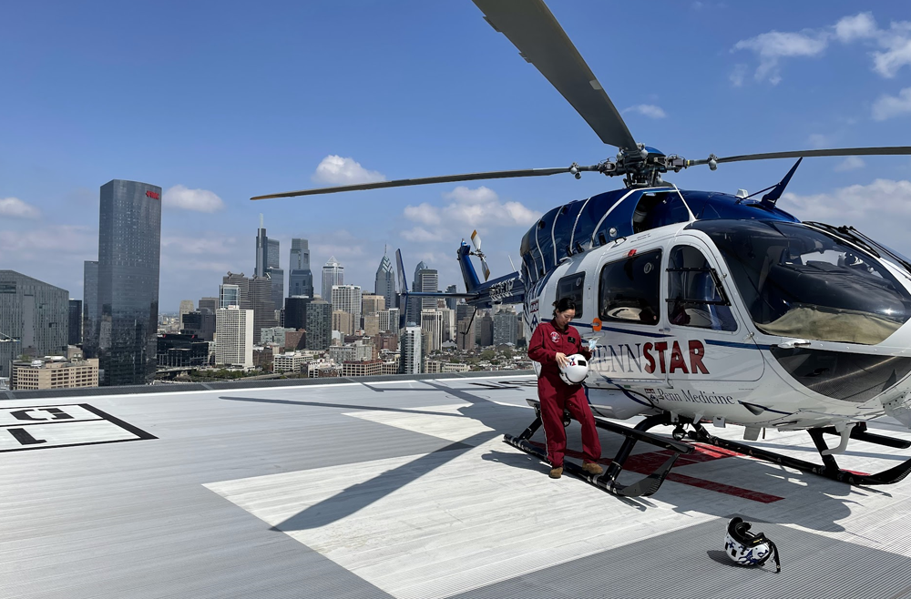 Lieutenant Hyun Kyoung "Sally" Na, RN, a nurse on the Navy team with the PennSTAR helicopter atop Penn Presbyterian Medical Center during her rotation with the Flight Team.